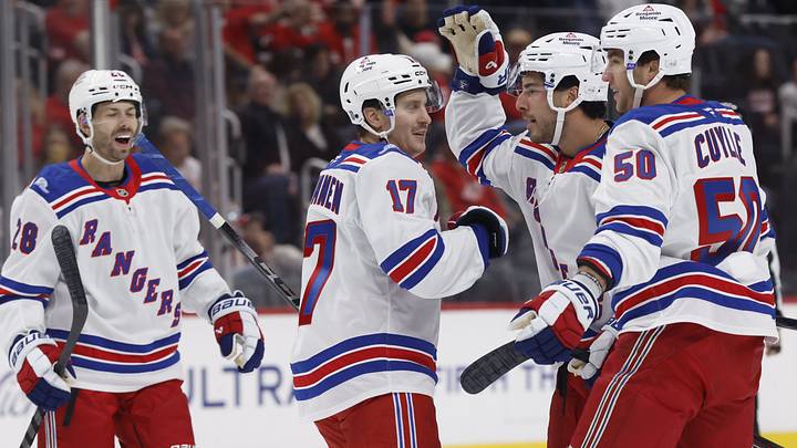 Oct 2, 2026; Detroit, Michigan, USA; New York Rangers defenseman Sean Durzi (5) receives congratulations from teammates after scoring in the first period against the Detroit Red Wings at Little Caesars Arena. Mandatory Credit: Rick Osentoski-Imagn Images Oct 2, 2026; Detroit, Michigan, USA; New York Rangers defenseman Sean Durzi (5) receives congratulations from teammates after scoring in the first period against the Detroit Red Wings at Little Caesars Arena. Mandatory Credit: Rick Osentoski-Imagn Images