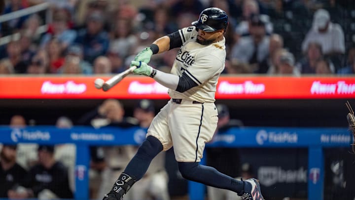 Sep 26, 2024; Minneapolis, Minnesota, USA; Minnesota Twins first base Carlos Santana (30) hits in the second inning against the Miami Marlins at Target Field.