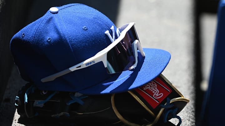 May 9, 2022; Baltimore, Maryland, USA; A detailed view of Kansas City Royals hat and glove in the dugout during the first inning against the Baltimore Orioles at Oriole Park at Camden Yards. Mandatory Credit: Tommy Gilligan-Imagn Images May 9, 2022; Baltimore, Maryland, USA; A detailed view of Kansas City Royals hat and glove in the dugout during the first inning against the Baltimore Orioles at Oriole Park at Camden Yards. Mandatory Credit: Tommy Gilligan-Imagn Images