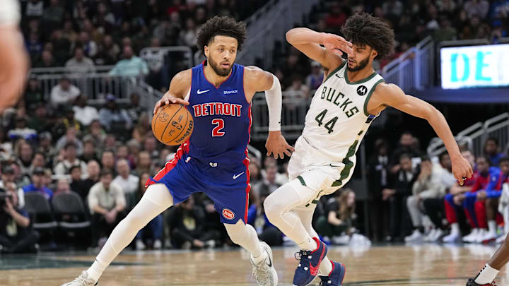 Nov 13, 2024; Milwaukee, Wisconsin, USA;  Detroit Pistons guard Cade Cunningham (2) drives for the basket around Milwaukee Bucks guard Andre Jackson Jr. (44) during the fourth quarter at Fiserv Forum. Mandatory Credit: Jeff Hanisch-Imagn Images