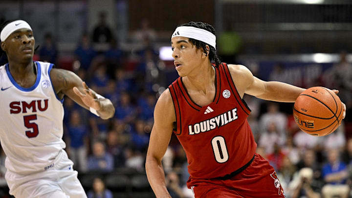 Feb 17, 2026; Dallas, Texas, USA; Louisville Cardinals guard Mikel Brown Jr. (0) brings the ball up court against the SMU Mustangs during the first half at Moody Coliseum. Mandatory Credit: Jerome Miron-Imagn Images