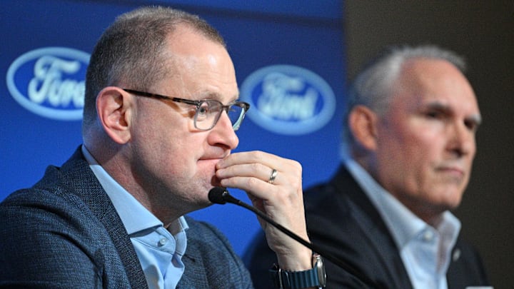 May 21, 2024; Toronto, Ontario, CANADA;  Toronto Maple Leafs general manager Brad Treliving listens to a question during a media conference to introduce new head coach Craig Berube (right) at Ford Performance Centre. Mandatory Credit: Dan Hamilton-Imagn Images