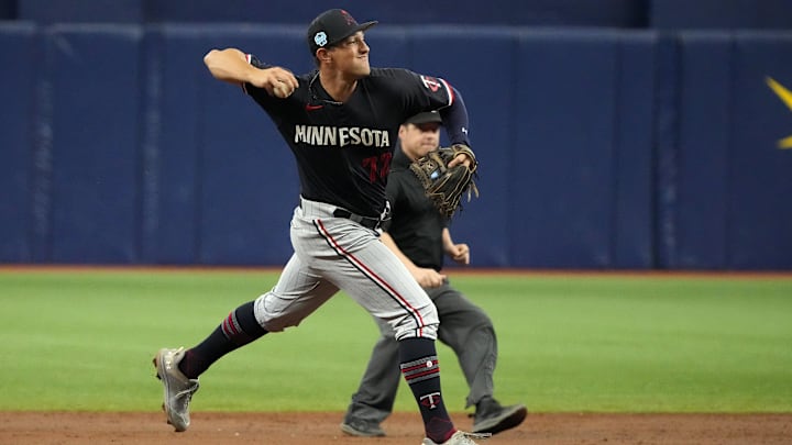 Mar 2, 2023; St. Petersburg, Florida, USA; Minnesota Twins shortstop Brooks Lee throws to first