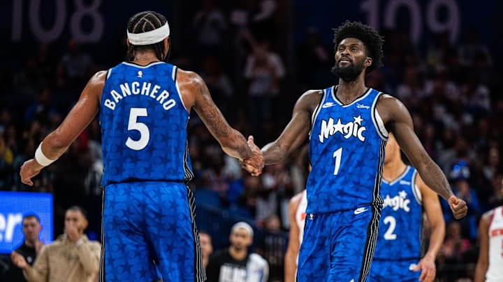 Orlando Magic forward Paolo Banchero (5) and forward Jonathan Isaac (1) celebrate a score against the New York Knicks in the third quarter at KIA Center. Orlando Magic forward Paolo Banchero (5) and forward Jonathan Isaac (1) celebrate a score against the New York Knicks in the third quarter at KIA Center.