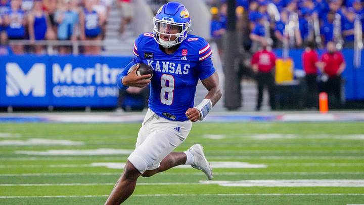 Sep 4, 2026; Lawrence, Kansas, USA; Kansas Jayhawks quarterback Isaiah Marshall (8) runs the ball against the LIU Sharks during the first half at David Booth Kansas Memorial Stadium. Mandatory Credit: Denny Medley-Imagn Images Sep 4, 2026; Lawrence, Kansas, USA; Kansas Jayhawks quarterback Isaiah Marshall (8) runs the ball against the LIU Sharks during the first half at David Booth Kansas Memorial Stadium. Mandatory Credit: Denny Medley-Imagn Images