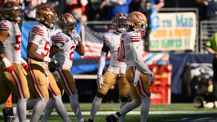 Oct 11, 2026; Seattle, Washington, USA; San Francisco 49ers cornerback Renardo Green (0) celebrates with teammates after making his second interception of the game against the Seattle Seahawks during the second half at Lumen Field. Mandatory Credit: Steven Bisig-Imagn Images Oct 11, 2026; Seattle, Washington, USA; San Francisco 49ers cornerback Renardo Green (0) celebrates with teammates after making his second interception of the game against the Seattle Seahawks during the second half at Lumen Field. Mandatory Credit: Steven Bisig-Imagn Images