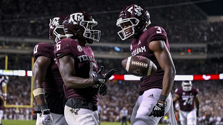 Texas A&M Aggies running back Devon Achane (6) and wide receiver Devin Price (3) celebrates a touchdown against the Miami Hurricanes during the second half at Kyle Field.
