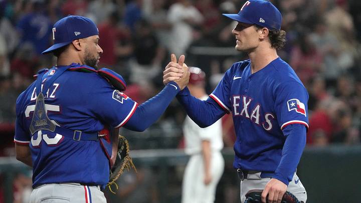 Texas Rangers pitcher Jacob Latz and catcher Elias Diaz shake hands after a win..  Credit: Rick Scuteri-Imagn Images
