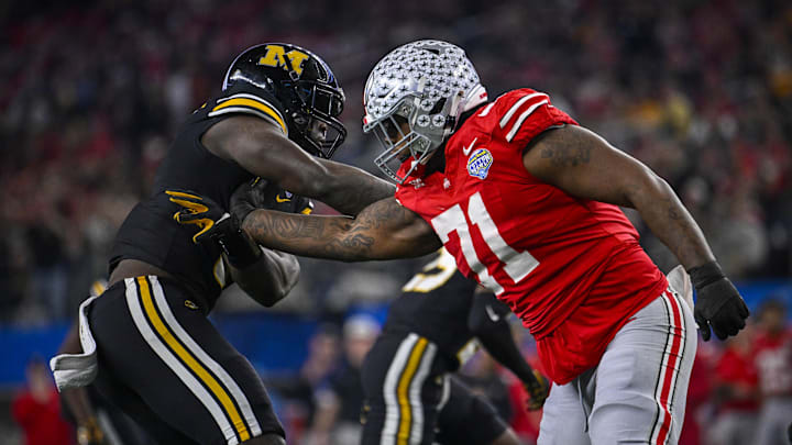 Dec 29, 2023; Arlington, TX, USA; Ohio State Buckeyes offensive lineman Josh Simmons (71) blocks Missouri Tigers defensive lineman Darius Robinson (6) during the second quarter at AT&T Stadium. Mandatory Credit: Jerome Miron-Imagn Images Dec 29, 2023; Arlington, TX, USA; Ohio State Buckeyes offensive lineman Josh Simmons (71) blocks Missouri Tigers defensive lineman Darius Robinson (6) during the second quarter at AT&T Stadium. Mandatory Credit: Jerome Miron-Imagn Images