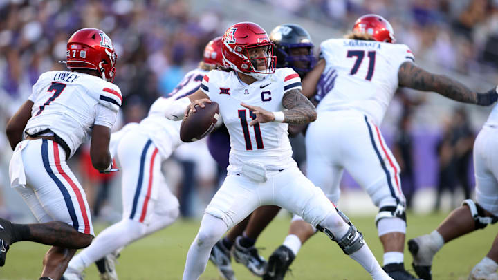 Nov 23, 2024; Fort Worth, Texas, USA; Arizona Wildcats quarterback Noah Fifita (11) throws a pass against the TCU Horned Frogs in the second half at Amon G. Carter Stadium. Mandatory Credit: Tim Heitman-Imagn Images Nov 23, 2024; Fort Worth, Texas, USA; Arizona Wildcats quarterback Noah Fifita (11) throws a pass against the TCU Horned Frogs in the second half at Amon G. Carter Stadium. Mandatory Credit: Tim Heitman-Imagn Images