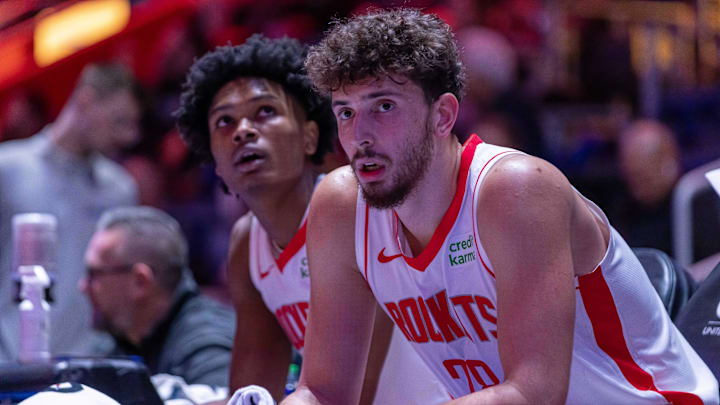 Jan 12, 2024; Detroit, Michigan, USA; Houston Rockets center Alperen Sengun (28) and forward Amen Thompson (1) sit on the sidelines on a play stoppage against the Detroit Pistons during the in the first half at Little Caesars Arena. Mandatory Credit: David Reginek-Imagn Images