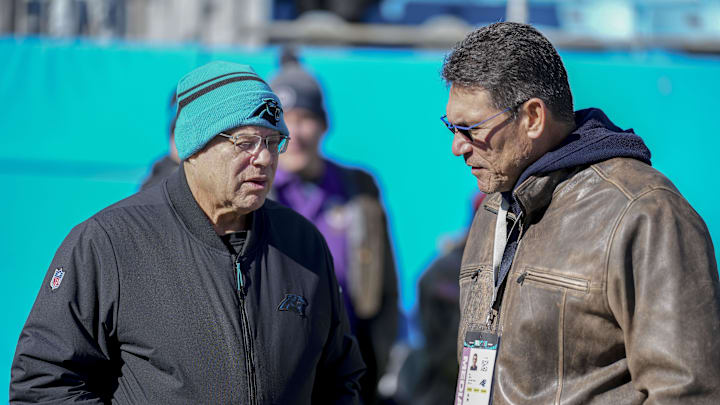 Dec 22, 2024; Charlotte, North Carolina, USA; Panthers owner David Tepper talks with former Panthers head coach Ron Rivera during pregame warmups at Bank of America Stadium. Mandatory Credit: Jim Dedmon-Imagn Images Dec 22, 2024; Charlotte, North Carolina, USA; Panthers owner David Tepper talks with former Panthers head coach Ron Rivera during pregame warmups at Bank of America Stadium. Mandatory Credit: Jim Dedmon-Imagn Images