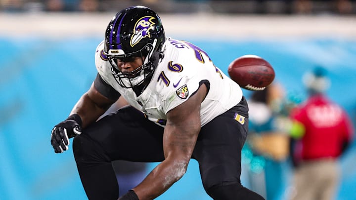 John Simpson of the Baltimore Ravens, above, made an additional $974,613 in Performance Based Pay, the NFL Announced on Monday. 