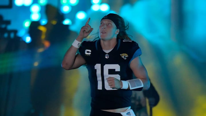 Jacksonville Jaguars quarterback Trevor Lawrence (16) runs out of the tunnel to the field through smoke, light's and lasers before the start of Monday night's game against the Bengals. The Jacksonville Jaguars hosted the Cincinnati Bengals at EverBank Stadium in Jacksonville, Florida for Monday Night Football, December 4, 2023. The Jaguars were tied 14 to 14 at the end of the first half. [Bob Self/Florida Times-Union]