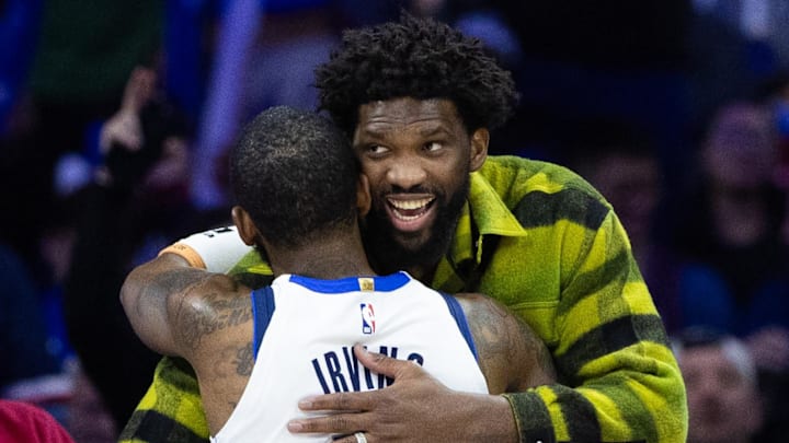 Feb 5, 2024; Philadelphia, Pennsylvania, USA; Philadelphia 76ers center Joel Embiid (R) greets Dallas Mavericks guard Kyrie Irving (11) during a break in action in the fourth quarter at Wells Fargo Center. Mandatory Credit: Bill Streicher-Imagn Images