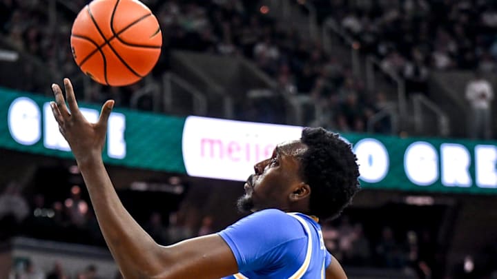 UCLA's Xavier Booker gets a rebound against Michigan State's Cam Ward during the second half on Tuesday, Feb. 17, 2026, at the Breslin Center in East Lansing.