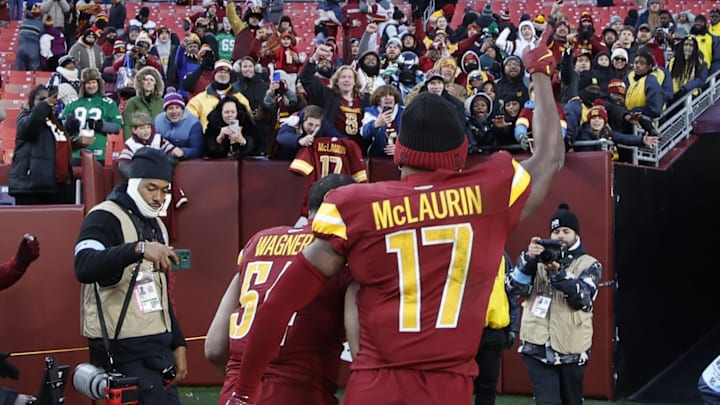 Dec 22, 2024; Landover, Maryland, USA; Washington Commanders wide receiver Terry McLaurin (17) celebrates while leaving the field with Commanders linebacker Bobby Wagner (54) after their game against the Philadelphia Eagles at Northwest Stadium. Mandatory Credit: Geoff Burke-Imagn Images Dec 22, 2024; Landover, Maryland, USA; Washington Commanders wide receiver Terry McLaurin (17) celebrates while leaving the field with Commanders linebacker Bobby Wagner (54) after their game against the Philadelphia Eagles at Northwest Stadium. Mandatory Credit: Geoff Burke-Imagn Images