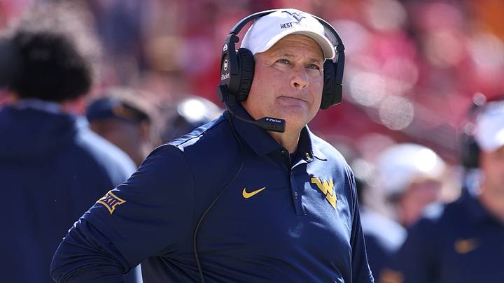 Oct 3, 2026; Ames, Iowa, USA; West Virginia Mountaineers head coach Rich Rodriguez watches his team play the Iowa State Cyclones during the second half at Jack Trice Stadium. Mandatory Credit: Reese Strickland-Imagn Images Oct 3, 2026; Ames, Iowa, USA; West Virginia Mountaineers head coach Rich Rodriguez watches his team play the Iowa State Cyclones during the second half at Jack Trice Stadium. Mandatory Credit: Reese Strickland-Imagn Images