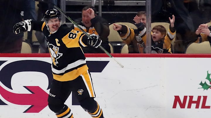 Nov 23, 2024; Pittsburgh, Pennsylvania, USA;  Pittsburgh Penguins center Sidney Crosby (87) reacts after scoring his 600th career NHL goal against the Utah Hockey Club during the second period at PPG Paints Arena. Mandatory Credit: Charles LeClaire-Imagn Images