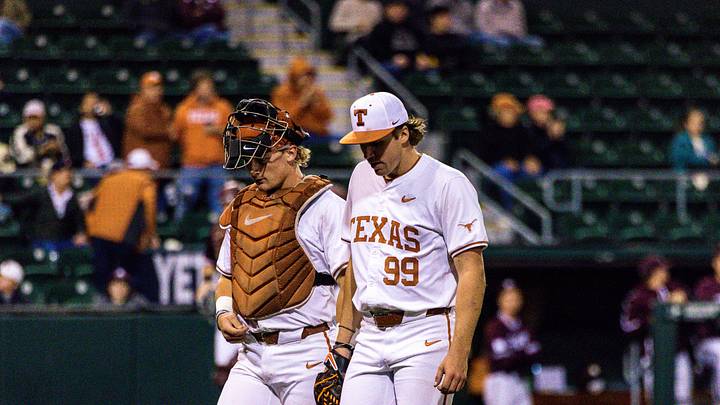 Sophomore pitcher Dylan Volantis and junior catcher Carson Tinney walk to the Texas dugout. Sophomore pitcher Dylan Volantis and junior catcher Carson Tinney walk to the Texas dugout.