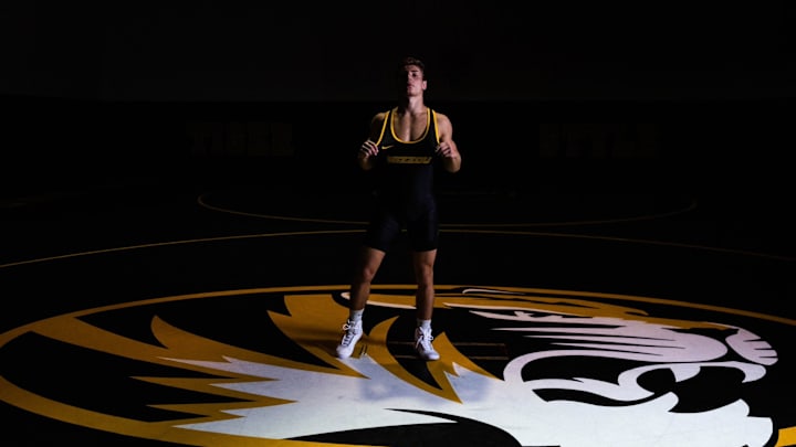 Missouri wrestling redshirt freshman Jarrett Stoner (285) stands on the Tiger logo for media day. 
