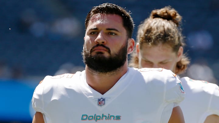 Miami Dolphins tight end Chris Myarick (85) runs off the field after warmups before the game against the Chicago Bears at Soldier Field in the 2021 preseason.