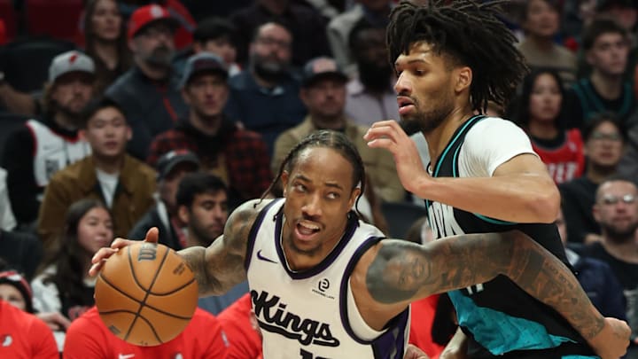 Dec 18, 2025; Portland, Oregon, USA;  Sacramento Kings guard/forward Demar Derozan (10) drives to the basket past Portland Trail Blazers guard Shaedon Sharpe (17) during the second half at Moda Center. Mandatory Credit: Jaime Valdez-Imagn Images