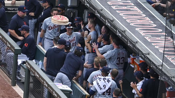 Sep 22, 2024; Baltimore, Maryland, USA;  Detroit Tigers first base Spencer Torkelson (20) celebrates with teammates in the dugout during the second inning after hitting a solo home run against the Baltimore Orioles at Oriole Park at Camden Yards.