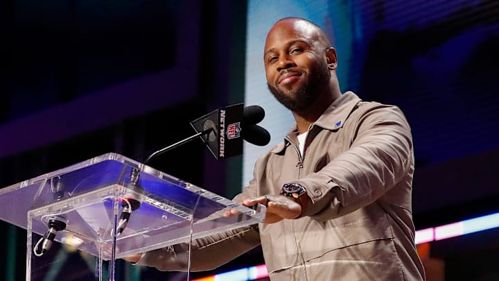 Former New England Patriots running back James White announces the team’s selection with the 95th overall pick during the round of the 2025 NFL Draft on Friday, April 25, 2025, at Lambeau Field in Green Bay, Wisconsin. 
