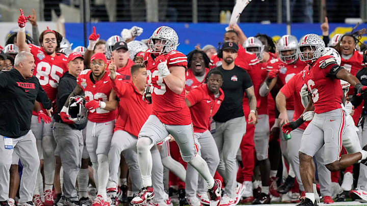 Ohio State Buckeyes defensive end Jack Sawyer (33) knocks the ball out of the hands of Texas Longhorns quarterback Quinn Ewers (3) and returns the fumble for a touchdown in the fourth quarter of the Cotton Bowl Classic during the College Football Playoff semifinal game at AT&T Stadium in Arlington, Texas on January, 10, 2025. Ohio State Buckeyes defensive end Jack Sawyer (33) knocks the ball out of the hands of Texas Longhorns quarterback Quinn Ewers (3) and returns the fumble for a touchdown in the fourth quarter of the Cotton Bowl Classic during the College Football Playoff semifinal game at AT&T Stadium in Arlington, Texas on January, 10, 2025.