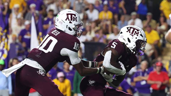 Sep 26, 2026; Baton Rouge, Louisiana, USA; Texas A&M Aggies quarterback Marcel Reed (10) hands off the ball to running back Carsyn Baker (5) during the first half against the LSU Tigers at Tiger Stadium. Mandatory Credit: Stephen Lew-Imagn Images Sep 26, 2026; Baton Rouge, Louisiana, USA; Texas A&M Aggies quarterback Marcel Reed (10) hands off the ball to running back Carsyn Baker (5) during the first half against the LSU Tigers at Tiger Stadium. Mandatory Credit: Stephen Lew-Imagn Images