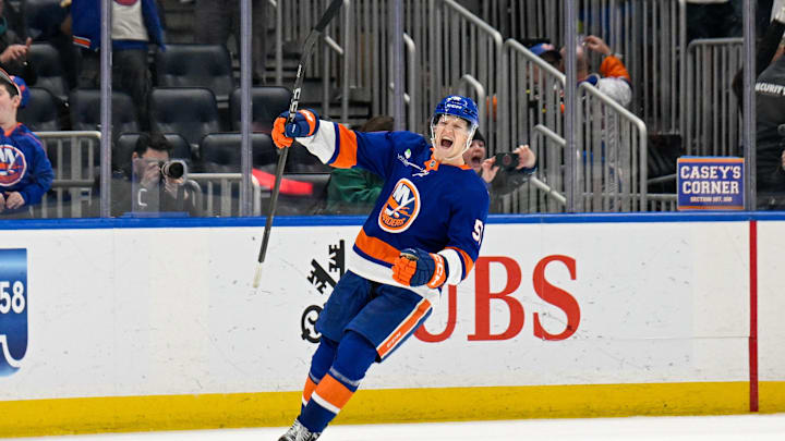 Dec 9, 2025; Elmont, New York, USA; New York Islanders left wing Emil Heineman (51) celebrates his winning goal after shootouts against the Vegas Golden Knights at UBS Arena. Mandatory Credit: Dennis Schneidler-Imagn Images