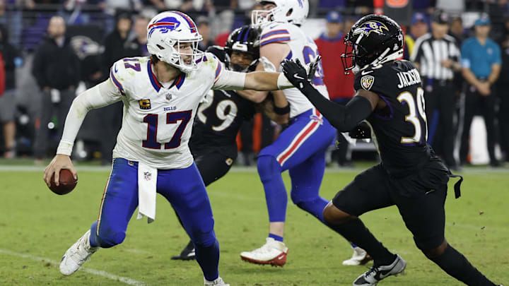 Sep 29, 2024; Baltimore, Maryland, USA; Buffalo Bills quarterback Josh Allen (17) scrambles from Baltimore Ravens safety Eddie Jackson (39) at M&T Bank Stadium.