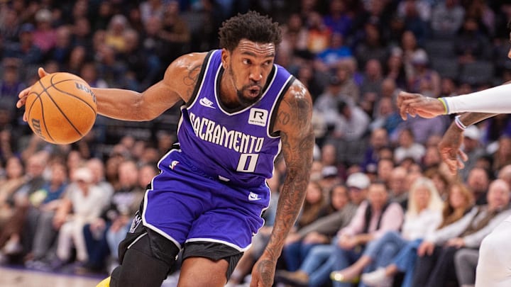 Feb 24, 2025; Sacramento, California, USA; Sacramento Kings guard Malik Monk (0) drives to the basket against the Charlotte Hornets during the second quarter at Golden 1 Center. 