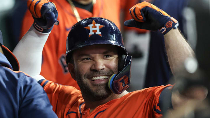 Jul 12, 2025; Houston, Texas, USA; Houston Astros left fielder Jose Altuve (27) celebrates his home run against the Texas Rangers by reacting to the TV cameras in the first inning at Daikin Park. 