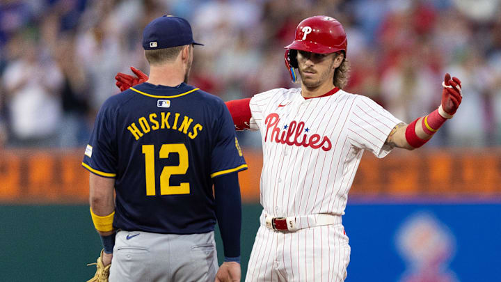 Jun 4, 2024; Philadelphia, Pennsylvania, USA; Philadelphia Phillies second base Bryson Stott (5) reacts in front of Milwaukee Brewers first base Rhys Hoskins (12) after hitting a double during the sixth inning at Citizens Bank Park. Jun 4, 2024; Philadelphia, Pennsylvania, USA; Philadelphia Phillies second base Bryson Stott (5) reacts in front of Milwaukee Brewers first base Rhys Hoskins (12) after hitting a double during the sixth inning at Citizens Bank Park.