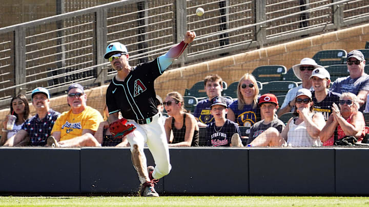 Arizona Diamondbacks right fielder Corbin Carroll catches a fly ball hit by Milwaukee Brewers Andruw Monasterio then throws it to third base in the second inning of a spring training game on Feb. 26, 2025, in Scottsdale at Salt River Fields at Talking Stick.