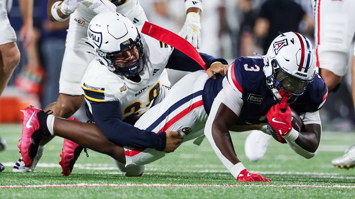 Sep 5, 2026; Tucson, Arizona, USA; Arizona Wildcats running back Kedrick Reescano (3) gets tackled during the second quarter of the game against the Northern Arizona Lumberjacks at Casino Del Sol Stadium. Sep 5, 2026; Tucson, Arizona, USA; Arizona Wildcats running back Kedrick Reescano (3) gets tackled during the second quarter of the game against the Northern Arizona Lumberjacks at Casino Del Sol Stadium.