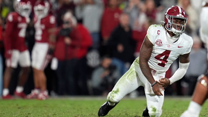 Alabama Crimson Tide quarterback Jalen Milroe (4) gets up after throwing an interception during a college football game between the University of Oklahoma Sooners (OU) and the Alabama Crimson Tide at Gaylord Family - Oklahoma Memorial Stadium in Norman, Okla., Saturday, Nov. 23, 2024. Oklahoma won 24-3.