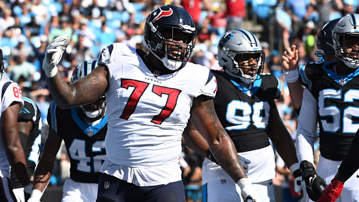 Oct 29, 2023; Charlotte, North Carolina, USA; Houston Texans offensive tackle George Fant (77) reacts in the first quarter at Bank of America Stadium. Mandatory Credit: Bob Donnan-Imagn Images