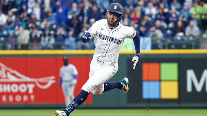 Seattle Mariners center fielder Julio Rodríguez runs after hitting an RBI triple against the Texas Rangers on April 12 at T-Mobile Park. Seattle Mariners center fielder Julio Rodríguez runs after hitting an RBI triple against the Texas Rangers on April 12 at T-Mobile Park.