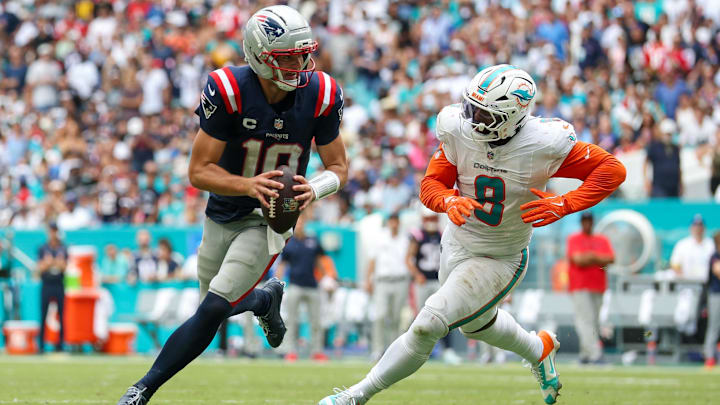 Sep 14, 2025; Miami Gardens, Florida, USA; New England Patriots quarterback Drake Maye (10) runs the ball chased by Miami Dolphins linebacker Matthew Judon (8) in the third quarter at Hard Rock Stadium. Mandatory Credit: Nathan Ray Seebeck-Imagn Images