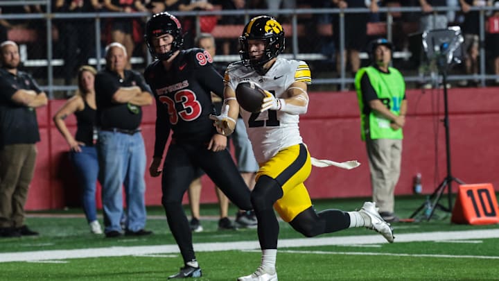 Sep 19, 2025; Piscataway, New Jersey, USA; Iowa Hawkeyes wide receiver Kaden Wetjen (21) returns the opening kick off for a touchdown during the first quarter against the Rutgers Scarlet Knights at SHI Stadium. Mandatory Credit: Vincent Carchietta-Imagn Images