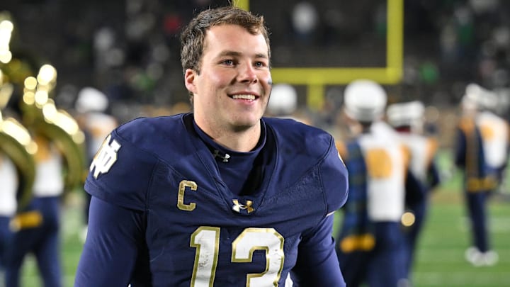 Nov 9, 2024; South Bend, Indiana, USA; Notre Dame Fighting Irish quarterback Riley Leonard (13) leaves the field following a 52-3 victory over the Florida State Seminoles at Notre Dame Stadium. Nov 9, 2024; South Bend, Indiana, USA; Notre Dame Fighting Irish quarterback Riley Leonard (13) leaves the field following a 52-3 victory over the Florida State Seminoles at Notre Dame Stadium.