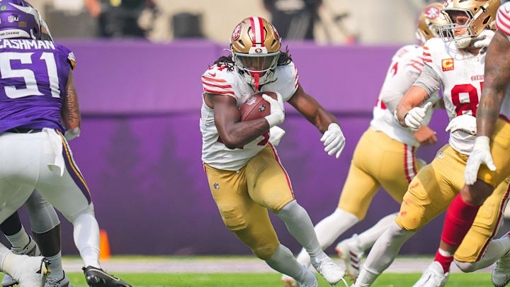 Sep 15, 2024; Minneapolis, Minnesota, USA; San Francisco 49ers running back Jordan Mason (24) runs with the ball against the Minnesota Vikings in the first quarter at U.S. Bank Stadium. Mandatory Credit: Brad Rempel-Imagn Images Sep 15, 2024; Minneapolis, Minnesota, USA; San Francisco 49ers running back Jordan Mason (24) runs with the ball against the Minnesota Vikings in the first quarter at U.S. Bank Stadium. Mandatory Credit: Brad Rempel-Imagn Images