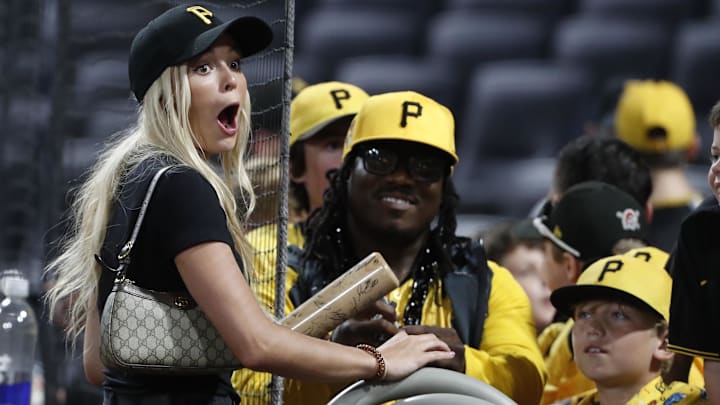 Louisiana State University gymnast Livvy Dunne (left) signs autographs after the Pittsburgh Pirates defeated the Los Angeles Dodgers at PNC Park.