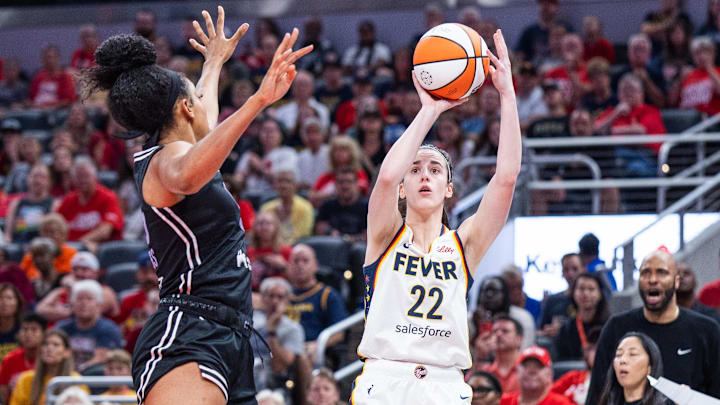 Jul 9, 2025; Indianapolis, Indiana, USA; Indiana Fever guard Caitlin Clark (22) shoots the ball while Golden State Valkyries forward Monique Billings (25) defends in the first half at Gainbridge Fieldhouse. Mandatory Credit: Trevor Ruszkowski-Imagn Images Jul 9, 2025; Indianapolis, Indiana, USA; Indiana Fever guard Caitlin Clark (22) shoots the ball while Golden State Valkyries forward Monique Billings (25) defends in the first half at Gainbridge Fieldhouse. Mandatory Credit: Trevor Ruszkowski-Imagn Images