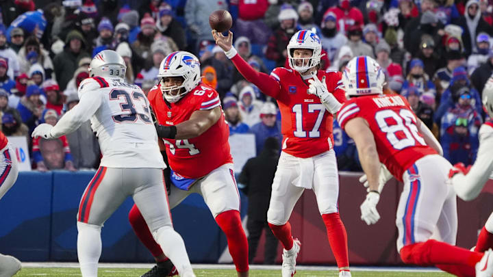Dec 22, 2024; Orchard Park, New York, USA; Buffalo Bills quarterback Josh Allen (17) throws the ball against the New England Patriots during the first half