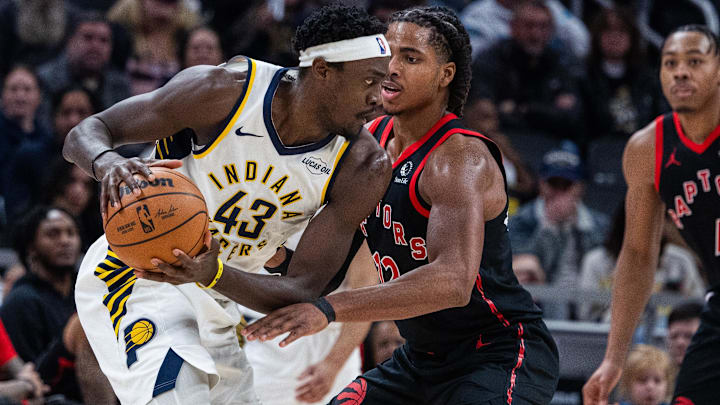 Jan 14, 2026; Indianapolis, Indiana, USA; Indiana Pacers forward Pascal Siakam (43) holds the ball while Toronto Raptors forward Collin Murray-Boyles (12) defends in the first half at Gainbridge Fieldhouse. Mandatory Credit: Trevor Ruszkowski-Imagn Images