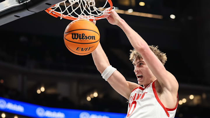Mar 11, 2025; Kansas City, MO, USA; Utah Utes forward Jake Wahlin (10) dunks during the first half against the UCF Knights at T-Mobile Center. 